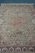 Persian Keshan design green ground rug,