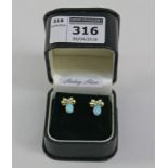 Pair silver gilt bow design earrings set with opals