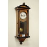 Early 20th century walnut and ebonised wood cased wall hanging Vienna style clock, H49cm,