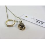 Gold pendant necklace set with a citrine hallmarked 9ct and a three stone diamond ring hallmarked