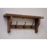 Waxed reclaimed pine coat rack fitted with three hooks,