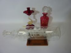 Small Victorian cranberry glass decanter with gilded decoration,