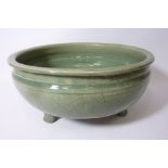 Chinese Celadon Green glazed stoneware bowl raised on three feet D31cm Condition Report