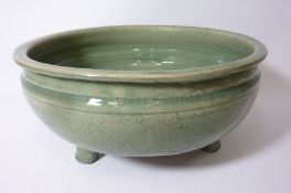 Chinese Celadon Green glazed stoneware bowl raised on three feet D31cm Condition Report