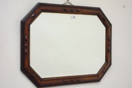 Early 20th century wall mirror in carved oak frame,