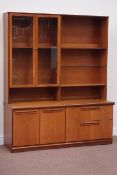 Large Meredew teak wall unit fitted with shelving and display cabinet enclosed by two glazed doors