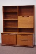 Large G-Plan teak wall unit fitted with shelving and fall front compartment above two drawers and
