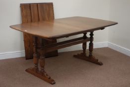 Ercol Golden Dawn finish elm extending dining table with three leaves,