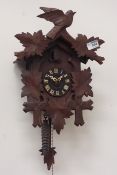 20th century carved wood cased cuckoo clock CLOCKS & BAROMETERS - as we are not a retailer,