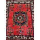 Old Persian red ground rug, 227cm x 169cm Condition Report <a href='//www.