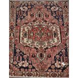 Persian Shiraz rug with floral medallion design,