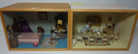 Diorama depicting a figure in a dining room and another similar depictuing a figure in a bedroom