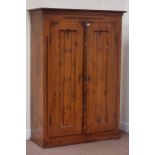 Continental pine two door wardrobe, interior fitted with shelving to one side, W118cm, H166cm,