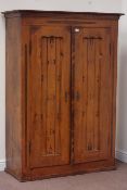 Continental pine two door wardrobe, interior fitted with shelving to one side, W118cm, H166cm,