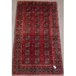 Turkoman Bokhara red ground rug, 214cm x 113cm Condition Report <a href='//www.