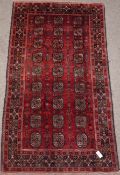 Turkoman Bokhara red ground rug, 214cm x 113cm Condition Report <a href='//www.