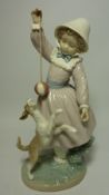 Lladro figure of a girl with a puppy Condition Report <a href='//www.