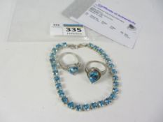 Blue topaz bracelet and two similar topaz rings all stamped 925 Condition Report