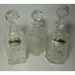 Three cut crystal decanters,