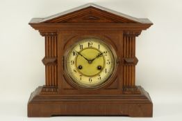 20th century oak architectural cased mantle clock, movement stamped 'Junghans',