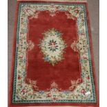 Chinese wash woollen rose colour ground rug,