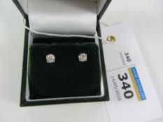 Pair of diamond ear-rings hallmarked 18ct approx 0.