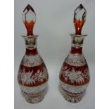 Pair 20th century ruby flashed cut crystal decanters with hallmarked silver collars H33cm