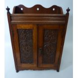 Edwardian oak smokers cabinet with contents including tobacco jar,