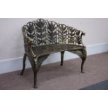 Bronzed finish heavy cast iron curved back bench, decorated with foliage and wings,