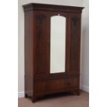 Edwardian walnut wardrobe enclosed by single bevel edged mirror door, with drawer to base, W128cm,