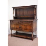 Early 20th century oak sideboard fitted with two drawers and two cupboards with raised panelled
