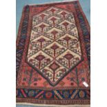 Persian Hamadan region peach and blue ground rug, geometric design,
