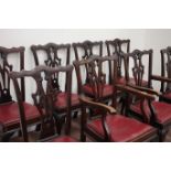 Early 20th century walnut set eight (4+2) Georgian style fret work splat back dining chairs raised
