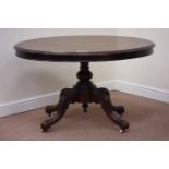 Victorian mahogany tilt top oval loo table raised on turned pedestal base fitted with four carved