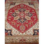 Persian Heriz design red and beige ground rug,