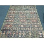 Aztec design green ground rug, 200cm x 140cm Condition Report <a href='//www.