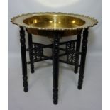 Early 20th century Eastern Benares tray top table on ebony stand Condition Report