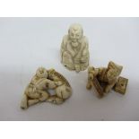 Early 20th century netsuke of a seated figure signed and two others Condition Report