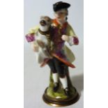 Mid 19th century continental porcelain novelty scent flask in the form of a man holding a dog (no