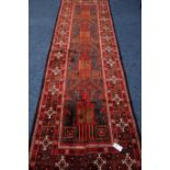 Persian Baluchi red ground runner rug, geometric design border,