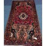 Persian Kerman red and blue ground rug,