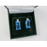 Emerald cut blue topaz and diamond pendant ear-rings stamped 750 Condition Report