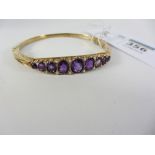 9ct gold hinged scrolled bangle set with amethyst and seed pearls hallmarked Condition