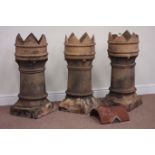 Three matching terracotta crown top Leeds Bishop chimney pots,