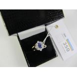 Tanzanite and diamond cluster reversible ring stamped 14K 585 Condition Report