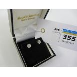 Pair of diamond ear-rings stamped 750 approx 1 carat total Condition Report <a