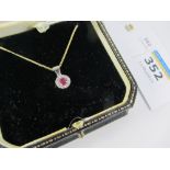 Ruby and diamond cluster pendant hallmarked 18ct on 40cm chain stamped 375 Condition