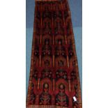 Persian Baluchi orange and red ground runner rug,
