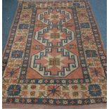 Turkish peach, blue and beige ground rug,
