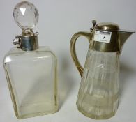 Cut glass claret jug with silver handle and top hallmarked Birmingham 1919 and a decanter with